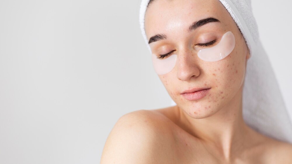 Woman with eye patches and closed eyes